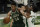 Milwaukee Bucks' Giannis Antetokounmpo passes around Boston Celtics' Robert Williams III during the first half of an NBA basketball game Wednesday, March 24, 2021, in Milwaukee. (AP Photo/Morry Gash)