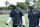 Miami Dolphins head coach Brian Flores and general manager Chris Grier walk off the field after NFL rookie camp practice on Friday, May 10, 2019, in Davie, Fla. (AP Photo/Brynn Anderson)