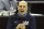 FILE- In this Friday, March 12, 2021, file photo, Utah State head coach Craig Smith reacts to a basket during the second half of an NCAA college basketball game against Colorado State in the semifinal round of the Mountain West Conference tournament in Las Vegas. Utah State and Texas Tech meet in a first-round game in the South Region on Friday. (AP Photo/Isaac Brekken, File)