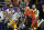 FILE - In this Jan. 13, 2020, file photo, LSU wide receiver Ja'Marr Chase catches a touchdown pass in front of Clemson cornerback A.J. Terrell during the first half of a NCAA College Football Playoff national championship game in New Orleans. All-America wide receiver Chase, cornerback Kary Vincent Jr. and defensive end Neil Farrell Jr. have announced they wonâ€™t be playing this season. (AP Photo/David J. Phillip, File)
