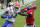FILE - Florida tight end Kyle Pitts (84) tires to get past Georgia defensive back Lewis Cine (16) after a reception during the first half of an NCAA college football game in Jacksonville, Fla., in this Saturday, Nov. 7, 2020, file photo. The Southeastern Conference championship game features two of the nation’s top playmakers, and neither is a quarterback. Alabama receiver DeVonta Smith and Florida tight end Kyle Pitts are the real stars of the league’s most potent offenses. (AP Photo/John Raoux, File)