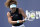 Naomi Osaka, of Japan, returns to Elise Mertens, of Beligium, during the Miami Open tennis tournament, Monday, March 29, 2021, in Miami Gardens, Fla. (AP Photo/Marta Lavandier)