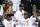 FILE - In this June 21, 2013, file photo, the Miami Heat's Dwyane Wade, left, holds the Larry O'Brien NBA Championship Trophy as LeBron James holds his Bill Russell NBA Finals Most Valuable Player Award and Chris Bosh, top, reacts after Game 7 of the NBA basketball championship against the San Antonio Spurs, in Miami. There have been superteams that found winning formulas, like Miami when James and Bosh joined Wade. (AP Photo/Wilfredo Lee, File)