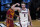 Gonzaga forward Drew Timme, right, celebrates in front of Southern California guard Tahj Eaddy, left, after making a basket during the first half of an Elite 8 game in the NCAA men's college basketball tournament at Lucas Oil Stadium, Tuesday, March 30, 2021, in Indianapolis. (AP Photo/Darron Cummings)