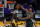 Milwaukee Bucks forward Giannis Antetokounmpo (34) blocks a shot by Los Angeles Lakers center Montrezl Harrell (15) during the third quarter of an NBA basketball game Wednesday, March 31, 2021, in Los Angeles. (AP Photo/Ashley Landis)