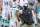 FILE - Miami Dolphins head coach Brian Flores talks to quarterback Tua Tagovailoa (1) on the sidelines as the Dolphins play against the Los Angeles Chargers during an NFL football game in Miami Gardens, Fla., in this Sunday, Nov. 15, 2020, file photo. The San Francisco 49ers have made a big move to grab their quarterback of the future by trading up with Miami for the No. 3 pick in next month's draft. For the Dolphins, the trade signals theyâ€™re not in the market for another potential franchise quarterback, and will stake their future on Tua Tagovailoa. (AP Photo/Doug Murray, File)
