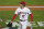 Los Angeles Angels starting pitcher Shohei Ohtani walks off the field during the fifth inning of the team's baseball game against the Chicago White Sox on Sunday, April 4, 2021, in Anaheim, Calif. Ohtani and White Sox's Jose Abreu collided at the plate while Ohtani was covering after a passed ball. Abreu and Adam Eaton both scored. Ohtani left the game. (AP Photo/Ashley Landis)