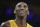 FILE - In this April 13, 2016, file photo, Los Angeles Lakers forward Kobe Bryant smiles during the first half of his last NBA basketball game, against the Utah Jazz in Los Angeles. The Naismith Memorial Basketball Hall of Fame was gearing up for a great year: not just the certain election of NBA superstars like Kobe Bryant, Kevin Garnett and Tim Duncan, but also a chance to unveil a completely renovated museum. Because of the coronavirus outbreak, the reopening has been pushed back two months to July 1 and the induction ceremony is being postponed, either to October or the spring. (AP Photo/Jae C. Hong, File)