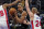 Brooklyn Nets forward Nicolas Claxton grabs the rebound next to Detroit Pistons center Mason Plumlee (24) during the first half of an NBA basketball game, Friday, March 26, 2021, in Detroit. (AP Photo/Carlos Osorio)