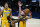 Los Angeles Clippers' Paul George (13) puts up a shot against Indiana Pacers' Domantas Sabonis (11) during the first half of an NBA basketball game, Tuesday, April 13, 2021, in Indianapolis. (AP Photo/Darron Cummings)