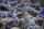 Los Angeles Rams players put on their helmets before an NFL football game against the Seattle Seahawks, Sunday, Dec. 27, 2020, in Seattle. (AP Photo/Scott Eklund)