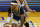 Golden State Warriors guard Gary Payton II (0) dribbles against Denver Nuggets guard Facundo Campazzo during an NBA basketball game in San Francisco, Monday, April 12, 2021. (AP Photo/Jeff Chiu)