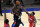 New York Knicks forward Julius Randle (30) shoots in front of New Orleans Pelicans guard Eric Bledsoe (5) during the second half of an NBA basketball game Sunday, April 18, 2021, in New York. (AP Photo/Adam Hunger, Pool)