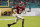 FILE - In this  Monday, Jan. 11, 2021 file photo, Alabama wide receiver DeVonta Smith runs for a touchdown against Ohio State during the first half of an NCAA College Football Playoff national championship game in Miami Gardens, Fla. Heisman Trophy winner DeVonta Smith of Alabama is scheduled to appear in person in Cleveland at the NFL draft later this month. Smith, the wide receiver projected to be a high first-round pick, is among a group of players who have accepted their invitations to attend the draft.(AP Photo/Chris O'Meara, File)