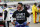 FILE - Driver Bubba Wallace wears a Black Lives Matter shirt as he prepares for a NASCAR Cup Series auto race Wednesday, June 10, 2020, in Martinsville, Va. NASCAR drivers don't plan to boycott Saturday night's, Aug. 29 race at Daytona International Speedway to raise awareness of social and racial injustices. Bubba Wallace, the only fulltime Black driver in the elite Cup Series, said that decision should not be interpreted as