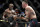 Kamaru Usman kicks Colby Covington in a mixed martial arts welterweight championship bout at UFC 245, Saturday, Dec. 14, 2019, in Las Vegas. (AP Photo/John Locher)