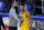 Golden State Warriors coach Steve Kerr, left, celebrates with guard Stephen Curry after the Warriors defeated the Milwaukee Bucks in an NBA basketball game in San Francisco, Tuesday, April 6, 2021. (AP Photo/Jeff Chiu)