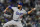Los Angeles Dodgers relief pitcher David Price works against the Colorado Rockies in the seventh inning of a baseball game Friday, April 2, 2021, in Denver. (AP Photo/David Zalubowski)