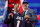 Alabama quarterback Mac Jones, right, holds a team jersey with NFL Commissioner Roger Goodell after the New England Patriots selected him with the 15th pick in the NFL football draft, Thursday April 29, 2021, in Cleveland. (AP Photo/Tony Dejak)