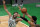 Boston Celtics forward Jayson Tatum (0) competes for a loose ball with San Antonio Spurs forward Keldon Johnson, right, during the first half of an NBA basketball game Friday, April 30, 2021, in Boston. (AP Photo/Elise Amendola)