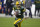 FILE - In this Jan. 16, 2021, file photo, Green Bay Packers quarterback Aaron Rodgers (12) runs with the ball during the team's NFL divisional playoff football game against the Los Angeles Rams in Green Bay, Wis. Rodgers earned his third Associated Press Most Valuable Player award, Saturday, Feb. 6, at the NFL Honors. (AP Photo/Jeffrey Phelps, File)