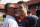 Denver Broncos quarterback Tim Tebow, right, gets a hug from his college coach at Florida, Urban Meyer, after the Broncos defeated the Miami Dolphins 18-15 in overtime in an NFL football game, Sunday, Oct. 23, 2011, in Miami. (AP Photo/Hans Deryk)