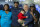 Dallas Cowboys first round draft pick linebacker Micah Parsons, second from left, poses for photos with his mom, Sherese Parsons, left, son Malcom, 2, owner Jerry Jones, fourth from left, sister Shatara Parsons, fifth from left, and father Terrence Parsons Sr., right, at the Dallas Cowboys headquarters, Friday, April 30, 2021, in Frisco, Texas. (AP Photo/Brandon Wade)