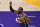 Los Angeles Lakers forward LeBron James directs the offense against the Sacramento Kings during the first half of an NBA basketball game Friday, April 30, 2021, in Los Angeles. (AP Photo/Marcio Jose Sanchez)