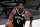 Brooklyn Nets' Kyrie Irving (11) handles the ball during an NBA basketball game against the Dallas Mavericks in Dallas, Thursday, May 6, 2021. (AP Photo/Tony Gutierrez)