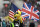 The Jacksonville Jaguars mascot carries the flags of the United States and Great Britian ahead of an NFL football game between the Houston Texans and the Jacksonville Jaguars, at Wembley Stadium, Sunday, Nov. 3, 2019, in London. (AP Photo/Ian Walton)