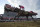 Flavien Prat atop Rombauer crosses the finish line to win the Preakness Stakes horse race at Pimlico Race Course, Saturday, May 15, 2021, in Baltimore. (AP Photo/Julio Cortez)