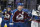 Colorado Avalanche center Nathan MacKinnon is congratulated as he passes the team box after scoring an empty-net goal against the St. Louis Blues late in the third period of Game 1 of an NHL hockey Stanley Cup first-round playoff series Monday, May 17, 2021, in Denver. Colorado won 4-1. (AP Photo/David Zalubowski)