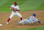 New York Mets Luis Guillorme (13) is out at second as Philadelphia Phillies shortstop Didi Gregorius (18) prepares to throw to first during the second inning of a baseball game, Tuesday, April 6, 2021, in Philadelphia. (AP Photo/Laurence Kesterson)