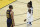 Memphis Grizzlies' Ja Morant, right, smiles after a foul was called against Golden State Warriors' Stephen Curry (30) during the second half of an NBA basketball Western Conference play-in game in San Francisco, Friday, May 21, 2021. (AP Photo/Jed Jacobsohn)