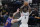 San Antonio Spurs center Gorgui Dieng (7) shoots over Phoenix Suns forward Frank Kaminsky (8) during the second half of an NBA basketball game in San Antonio, Saturday, May 15, 2021. (AP Photo/Eric Gay)