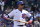Chicago Cubs' Javier Baez reacts as he walks to the dugout after being called out on strikes during the fourth inning of a baseball game against the Cincinnati Reds in Chicago, Sunday, May 30, 2021. (AP Photo/Nam Y. Huh)