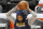 Utah Jazz guard Mike Conley stands on the court before Game 1 of the team's second-round NBA basketball playoff series against the Los Angeles Clippers on Tuesday, June 8, 2021, in Salt Lake City. Conley suffered a mild right hamstring strain in Game 5 against the Grizzlies, and he has been ruled out of Tuesday night's game. (AP Photo/Rick Bowmer)