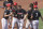 North Carolina State's Jonny Butler (14), center, celebrates with teammates, from left to right, DeAngelo Giles, Eddie Eisert, Austin Murr, Jose Torres and Danny Carnazzo (7) after scoring a run against Stanford in the ninth inning in the opening baseball game of the College World Series, Saturday, June 19, 2021, at TD Ameritrade Park in Omaha, Neb. (AP Photo/Rebecca S. Gratz)