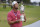 Jon Rahm, of Spain, kisses the champions trophy for photographers after the final round of the U.S. Open Golf Championship, Sunday, June 20, 2021, at Torrey Pines Golf Course in San Diego. (AP Photo/Marcio Jose Sanchez)