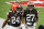 File-This Nov. 15, 2020, file photo shows Cleveland Browns running backs Nick Chubb (24) and Kareem Hunt (27) walking off the field after the Browns defeated the Houston Texans in Cleveland. One is quiet, super steady, and a rising NFL star. Cleveland's other running back is outgoing, flashy, and has his career back on track after a major detour. Chubb and Hunt couldn't be any different. (AP Photo/Ron Schwane, File)
