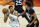 Milwaukee Bucks forward Giannis Antetokounmpo (34) looks to pass as Phoenix Suns forward Cameron Johnson (23)defends during the second half of Game 1 of basketball's NBA Finals, Tuesday, July 6, 2021, in Phoenix. (AP Photo/Matt York)