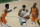 Milwaukee Bucks forward Giannis Antetokounmpo (34) drives to the basket between Phoenix Suns center Deandre Ayton, left, and forward Mikal Bridges (25) during the second half of Game 4 of basketball's NBA Finals Wednesday, July 14, 2021, in Milwaukee. (AP Photo/Aaron Gash)