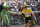Slovenia's Tadej Pogacar, wearing the overall leader's yellow jersey, and Britain's Mark Cavendish, wearing the best sprinter's green jersey, greet prior to the start of the nineteenth stage of the Tour de France cycling race over 207 kilometers (128.6 miles) with start in Mourenx and finish in Libourne, France,Friday, July 16, 2021. (AP Photo/Daniel Cole)