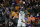 Milwaukee Bucks guard Jrue Holiday (21) shoots against the Phoenix Suns during the second half of Game 5 of basketball's NBA Finals, Saturday, July 17, 2021, in Phoenix. (AP Photo/Ross D. Franklin)