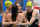 Australia's Cate Campbell (R) and teammates celebrate after setting a world record and winning the final of the women's 4x100m freestyle relay swimming event during the Tokyo 2020 Olympic Games at the Tokyo Aquatics Centre in Tokyo on July 25, 2021. (Photo by Oli SCARFF / AFP) (Photo by OLI SCARFF/AFP via Getty Images)