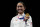 Gold medalist Lee Kiefer of the United States, holds her gold medal during the medal ceremony for the women's individual Foil final competition at the 2020 Summer Olympics, Sunday, July 25, 2021, in Chiba, Japan. (AP Photo/Hassan Ammar)
