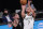 Brooklyn Nets forward Joe Harris (12) defends Milwaukee Bucks guard Bryn Forbes (7) as Forbes attempts a three-point shot during the first half of Game 2 of an NBA basketball second-round playoff series, Monday, June 7, 2021, in New York. (AP Photo/Kathy Willens)
