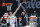 Milwaukee Bucks center Brook Lopez (11) defends as Sacramento Kings center Richaun Holmes (22) shoots during the first quarter of an NBA basketball game in Sacramento, Calif., Saturday, April 3, 2021. (AP Photo/Randall Benton)