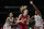 United States' Breanna Stewart (10) drives to the basket between France's Gabrielle Williams (15), left, and Sandrine Gruda (7), right, during women's basketball preliminary round game at the 2020 Summer Olympics, Monday, Aug. 2, 2021, in Saitama, Japan. (AP Photo/Eric Gay)