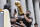 Milwaukee Bucks' Giannis Antetokounmpo, front right, holds up the NBA Championship Trophy as his mother, Veronica Antetokounmpo, left, takes a photo during a parade for the basketball team's NBA Championship win, Thursday, July 22, 2021, in Milwaukee. (AP Photo/Jeffrey Phelps)